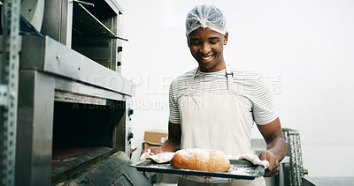 Buy stock photo Bread, baker and oven with black man in kitchen for cooking, culinary process or food production. Health, wheat and baking with person in coffee shop for catering, restaurant and small business owner