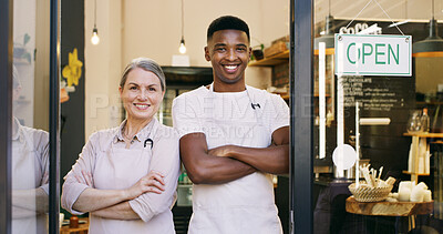 Buy stock photo Happy people, portrait and door with open sign in cafe entrance or ready for service. Man, woman or arms crossed with confidence, apron or smile for coffee shop, small business or restaurant startup