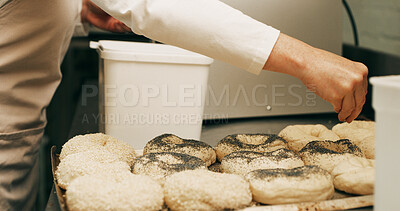 Buy stock photo Person, hands or sunflower seeds in bakery with dough for bread roll, cooking food or restaurant cuisine. Chef, grains and ingredients in kitchen with catering, meal prep or gluten free bagel recipe.