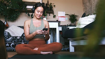 Buy stock photo Yoga, headphones and phone with woman in house for guided meditation, streaming and wellness podcast. Connection, zen and calm sound with person in home for fitness, radio subscription and music