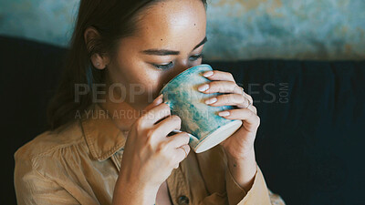 Buy stock photo Drinking, sofa and woman with coffee in home for wellness, calm and peace in morning. Aesthetic, living room and person with beverage, herbal tea and mug for relax, comfort and resting on weekend