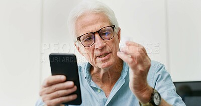 Buy stock photo Research, pills and phone with old man in home for dosage instruction, reading and side effects. Medicine, online pharmacy and medical information with senior person in apartment for prescription
