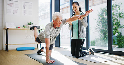Buy stock photo Fitness, pilates and personal trainer with senior man in studio for health, stretching or wellness. Exercise, yoga and coach with elderly male person for table pose for balance with workout together.
