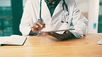 Doctor, hands and research with tablet for medical, telehealth or discovery in hospital. Closeup, employee or healthcare worker with technology or notebook for health service or study in clinic