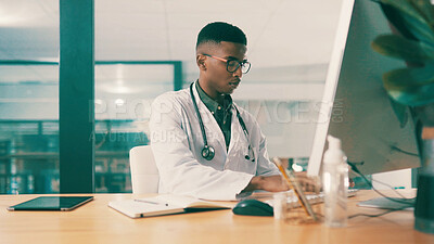 Buy stock photo Computer, notebook and typing with doctor black man at hospital desk for results report. Healthcare, medical and online research with medicine professional in office at clinic for agenda or schedule