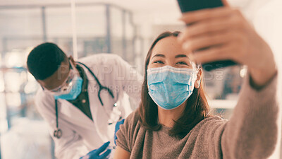 Buy stock photo Smile, woman and selfie with doctor for vaccine injection, photography and awareness on social media. People, face mask and profile picture of pandemic treatment, medical procedure and healthcare ppe