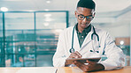 Tablet, black man and doctor in clinic with medical research for treatment planning. Digital technology, reading and African male healthcare worker with information for online diagnosis in hospital.