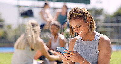 Buy stock photo Happy, sports and woman with phone on field for social media, online chatting and internet. Athlete, typing and person on smartphone for contact, relax and break after training, exercise and practice