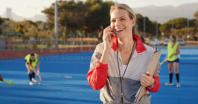 Buy stock photo Coach, hockey and happy woman with phone call for match organization, conversation and event info. Planning, mobile or sport trainer with clipboard on turf, game arrangement and local league opponent