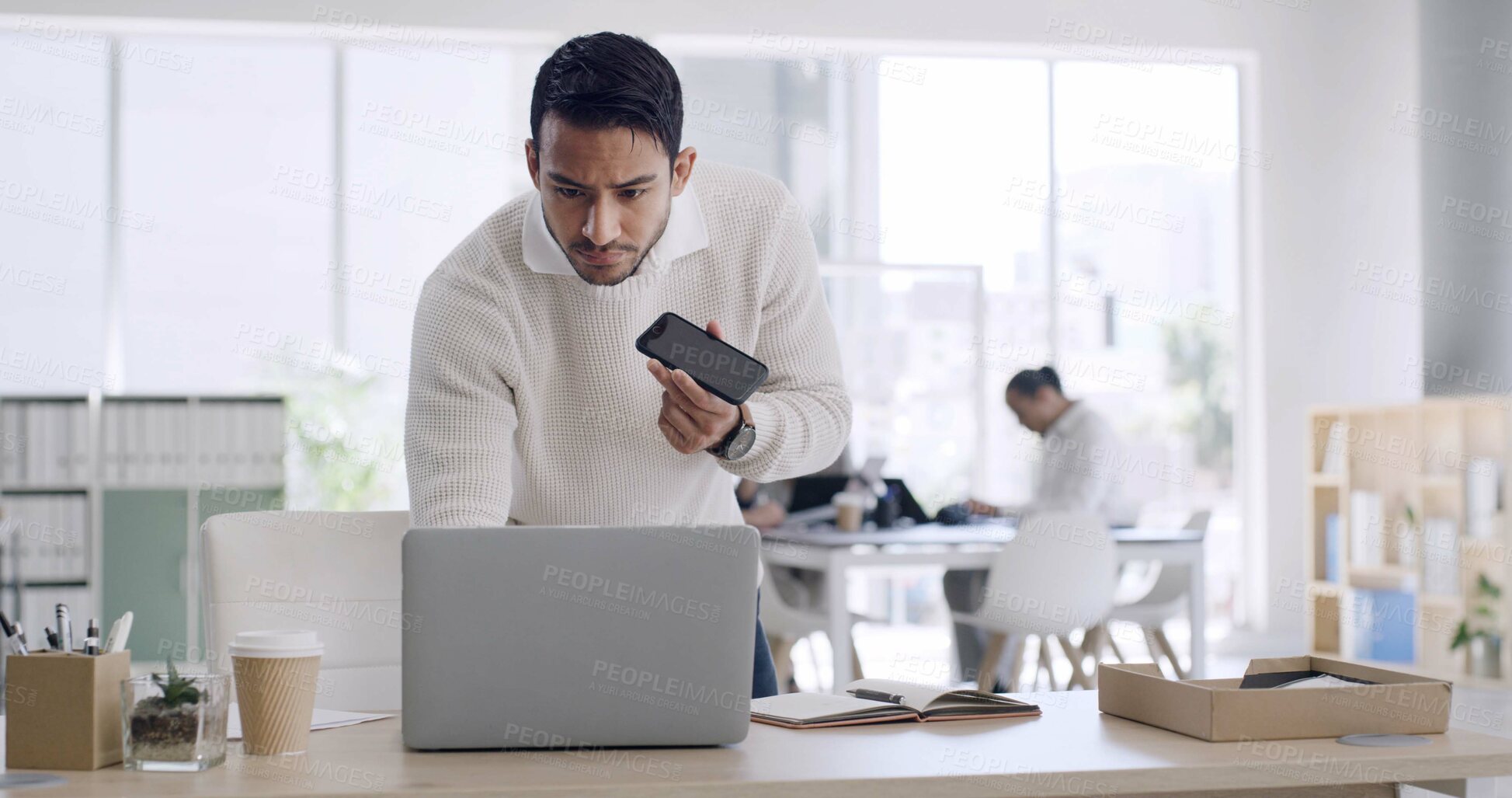 Buy stock photo Man, laptop and phone for voice message in office for feedback, schedule update and contact source. Person, technology and audio recording for article tips, project reminder and chat for publication