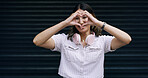 Happy woman, portrait and sign with heart hands in studio for love on a dark background. Female person, model or gen z with headphones, shape or emoji for romantic gesture, support or care on space