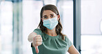 Woman, thumbs down and face mask for portrait in office for negative review, choice and symbol. Person, ppe and bad emoji with icon, decision and gesture with no sign for virus at corporate workplace