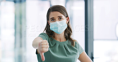 Buy stock photo Woman, thumbs down and face mask for portrait in office for negative review, choice and symbol. Person, ppe and bad emoji with icon, decision and gesture with no sign for virus at corporate workplace