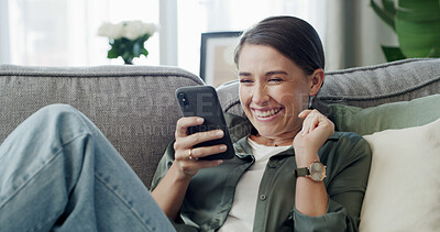 Buy stock photo Woman, scroll and laugh on sofa with phone for text message, social media chat or communication. Person smile, reading and typing on couch with tech for mobile app, internet and conversation in home.