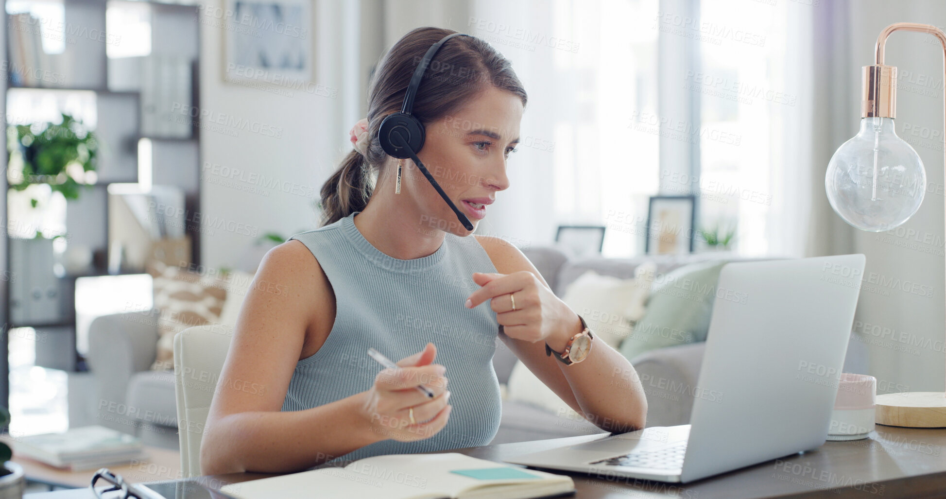 Buy stock photo Headset, laptop and notebook with woman in living room of home for customer service or support. Communication, computer and writing with freelance employee in apartment for help or remote work
