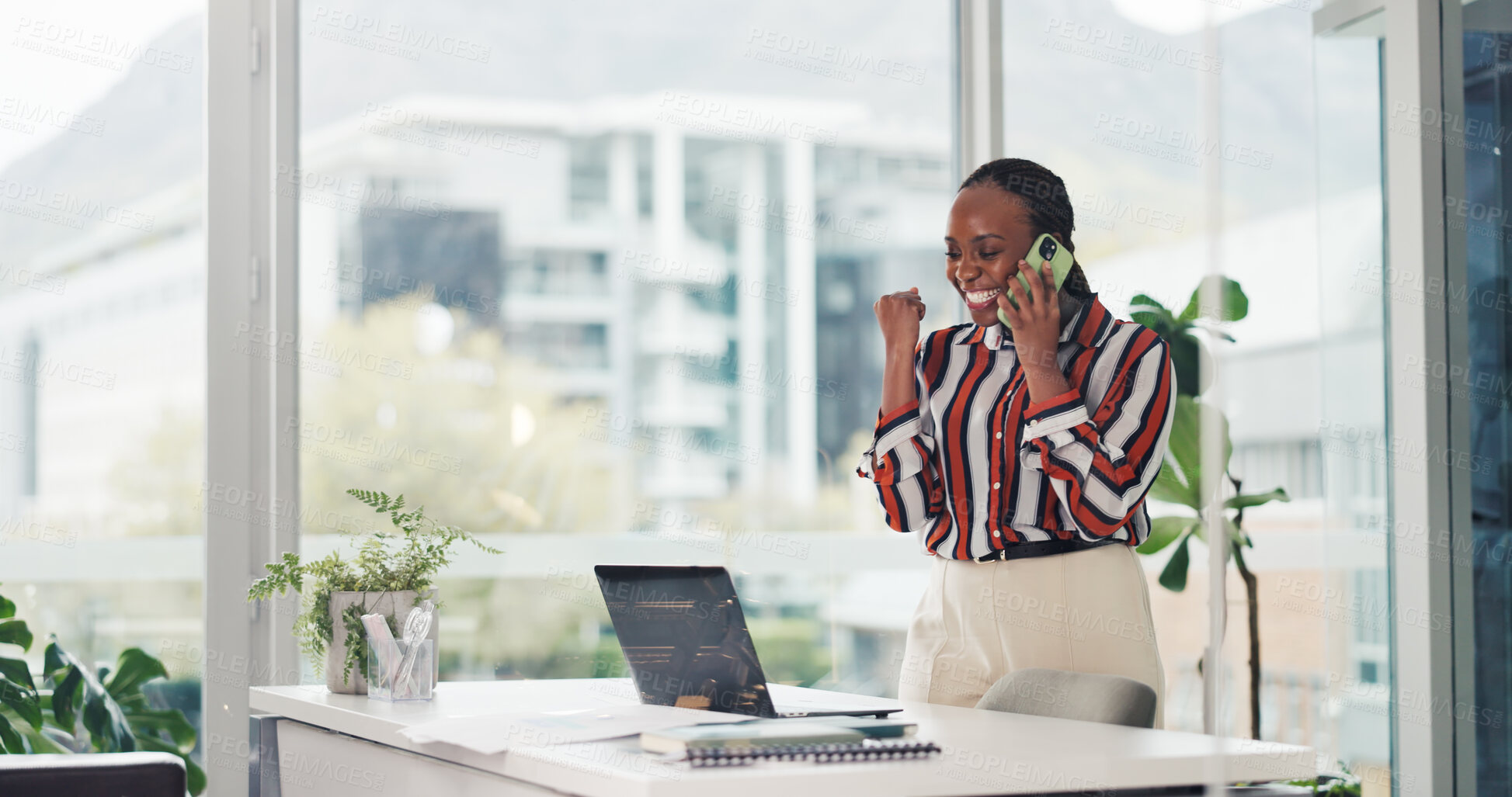 Buy stock photo Phone call, fist pump and black woman with laptop for good news, success and promotion. African person, consultation and excited in workplace with celebration, achievement and milestone goals