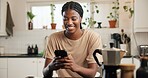 Black woman, phone and happy with texting in kitchen, contact or funny video on web at apartment. African person, smartphone and smile for notification, chat or social network with meme in house