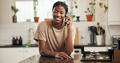 Buy stock photo Black woman, smile and phone call with conversation in kitchen, contact and gossip in home. African person, smartphone and happy with funny chat, discussion or listen to story in morning at apartment