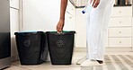 Hands, bottle and recycling bin in home with garbage, sustainability and organize in kitchen. Person, plastic container and sort with trash, waste and eco friendly for carbon footprint at apartment
