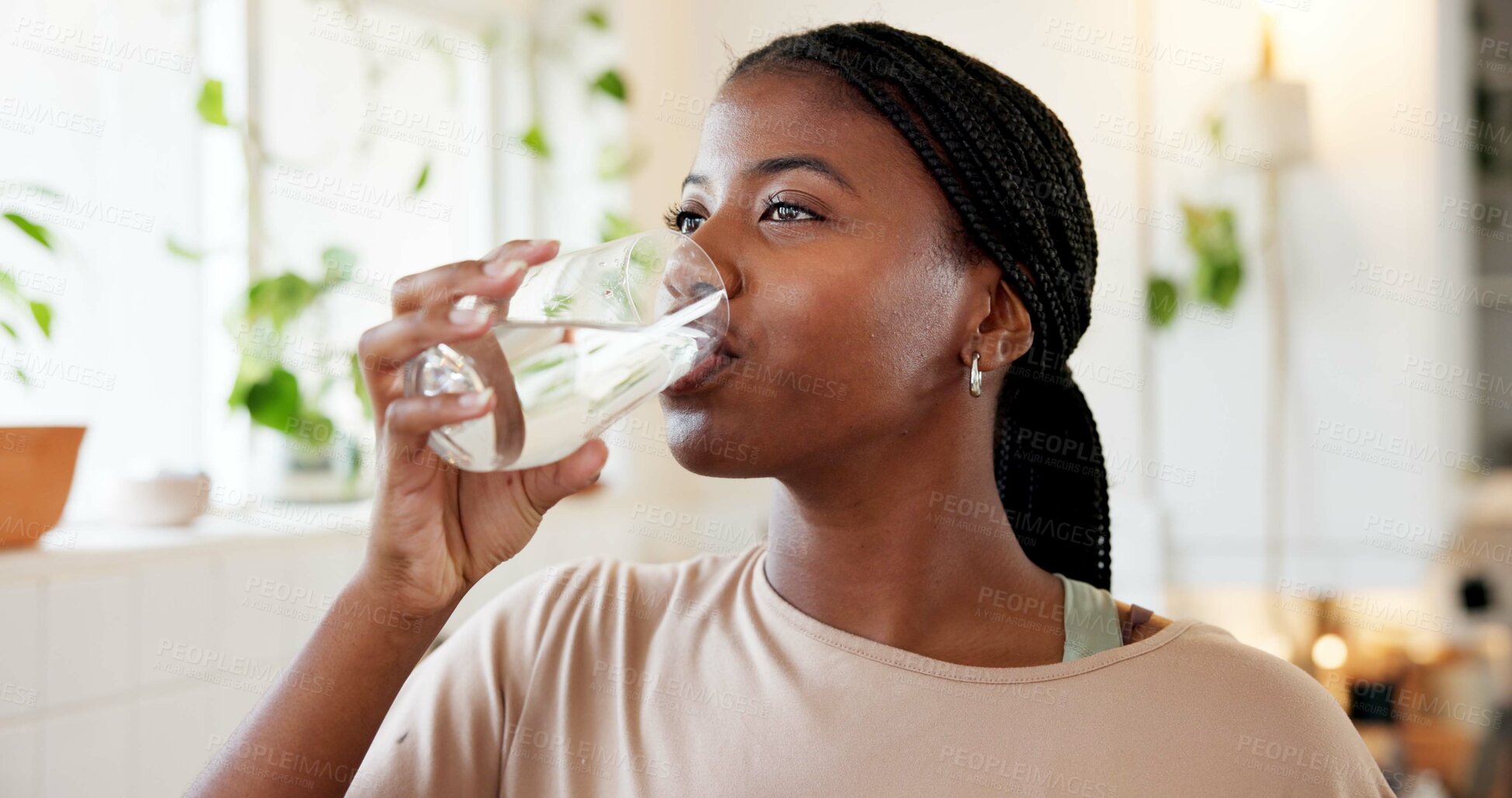Buy stock photo Home, hydration and woman drinking water in kitchen for natural nutrients, thirsty and detox. Body care, black person and liquid beverage in house for refreshing drink, wellness and digestive health