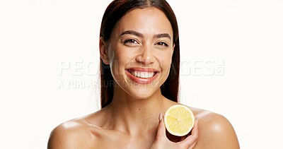 Buy stock photo Studio, portrait and woman with lemon, self care and confident for anti aging benefits and skincare. White background, space and person with fruit for natural cosmetics, vitamin c and dermatology