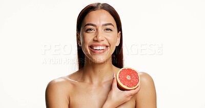 Buy stock photo Studio, portrait and woman with grapefruit, skincare and facial treatment for collagen boost or glow. White background, space and person with fruit for natural cosmetics, vitamin c and dermatology