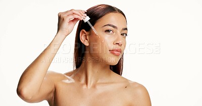 Buy stock photo Woman, dropper and oil in studio for beauty, skincare and moisturizer with mockup space on white background. Girl, person and serum with natural cosmetics, transformation and dermatology in Mexico