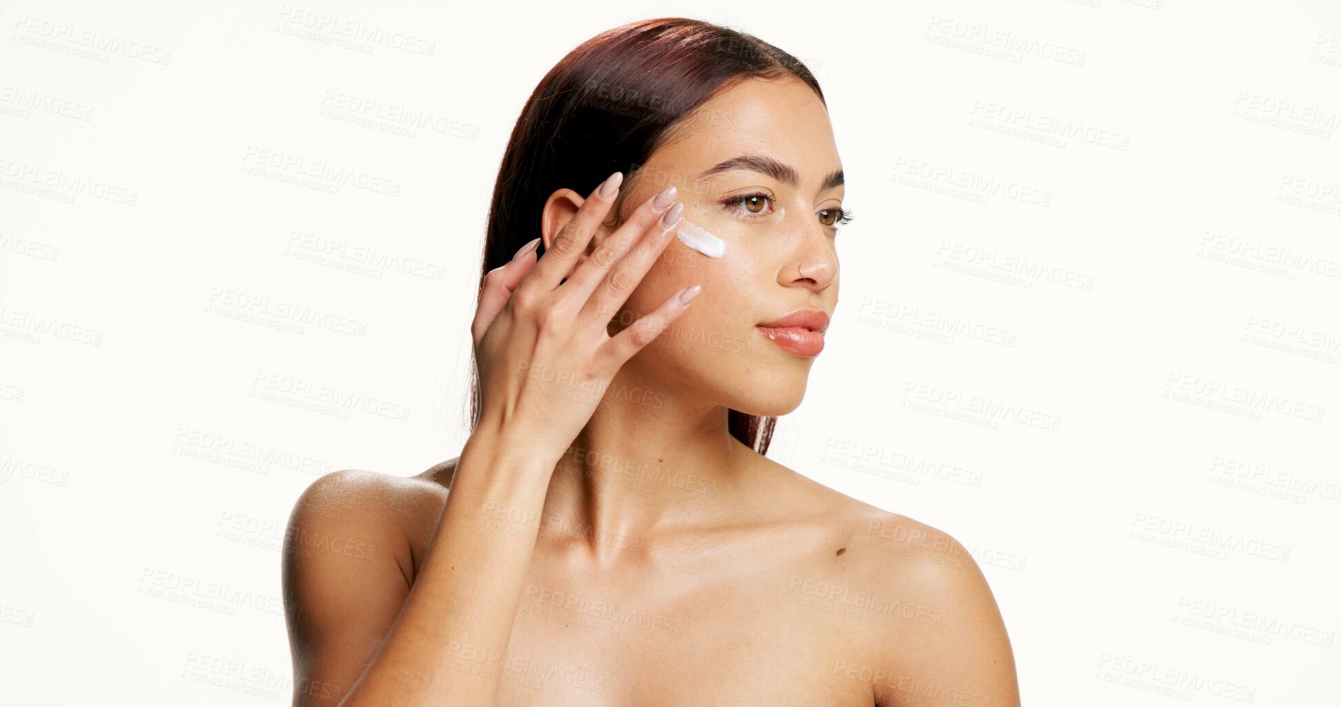 Buy stock photo Beauty, skincare and woman with face cream in studio for skin hydration, healthy glow and collagen. Mockup space, girl and apply treatment on white background for self care, moisturizer and benefits