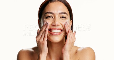 Buy stock photo Beauty, woman and happy with face cream in studio for skin hydration, healthy glow or hyaluronic acid. Portrait, girl and apply product on white background for skincare, dermatology and mockup space