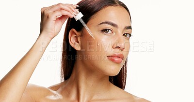 Buy stock photo Beauty, woman and skincare with dropper in studio for skin hydration, healthy glow or hyaluronic acid. Portrait, girl and retinol oil on white background for acne treatment, cosmetics or mockup space