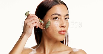 Buy stock photo Woman, jade roller and skincare in studio portrait, circulation and natural glow on white background. Person, facial treatment and tools for lymphatic drainage, mockup space or blood flow in Colombia