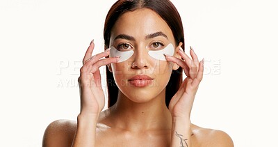 Buy stock photo Portrait, woman and eye patch in studio for skincare, dermatology or brightening dark circles. Confident, person or collagen mask for wellness, beauty or hyaluronic acid benefits on white background.