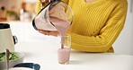 Pouring, smoothie and hands with blender, kitchen and healthy drink for nutrition boost and protein. Vegetarian, wellness and person with liquid for gut health benefits, home and detox with beverage