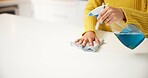 Hands, woman and cleaning counter with spray for germ disinfection, dirt removal and housekeeping. Space, person or antibacterial product in home for household maintenance, hygiene or domestic chores