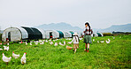 Back, mother and holding hands with child on chicken farm for agriculture, harvest livestock or bonding together. Woman, kid and basket for poultry inspection, collect eggs and walking in countryside