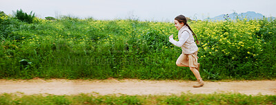Buy stock photo Energy, running and space with girl outdoor in countryside for child development or growth. Adventure, excited and path with happy kid in green nature for activity, journey or wilderness experience