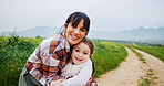 Portrait, grass field and mother hug child for bonding, love and connection for countryside vacation. Farm holiday, space and happy woman with support for girl, embrace and outdoor for relationship