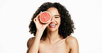 Happy woman, portrait and grapefruit with skincare in studio for vitamin C on a white background. Female person, model or smile with natural organic fruit for diet, detox or collagen on mockup space