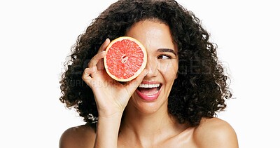 Buy stock photo Happy woman, grapefruit and beauty with skincare in studio for vitamin C on a white background. Female person, model or natural organic fruit with ingredient or antioxidant for health and wellness