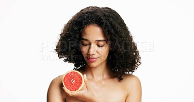 Buy stock photo Skincare, grapefruit and woman in studio with beauty, natural or organic cosmetics for wellness. Vitamin c, space and female person with citrus fruit for facial dermatology by white background.