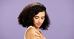 Beauty, manicure and shoulder of woman in studio for cosmetics or dermatology results. Aesthetic, natural hair and touch with model isolated on purple background for nail cosmetology or skincare