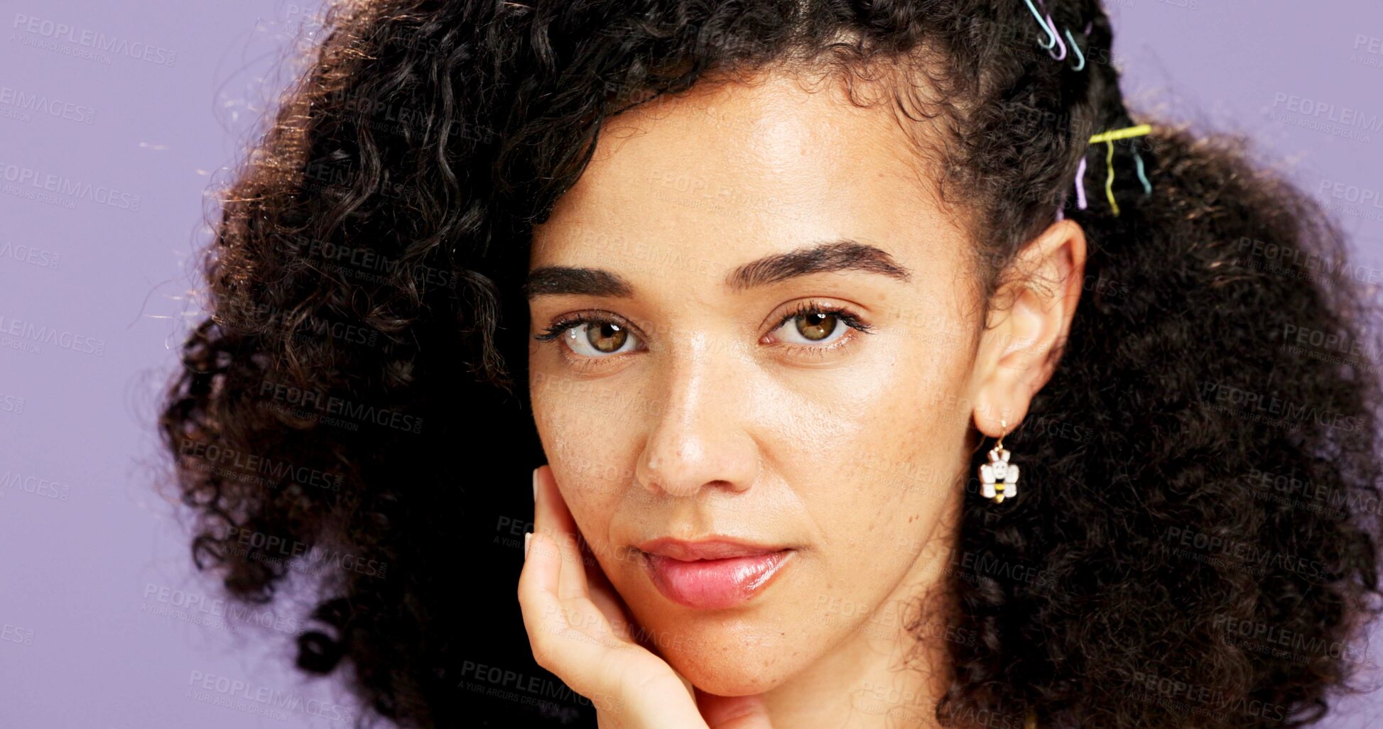 Buy stock photo Portrait, touch and woman in studio for skincare, natural aesthetic or facial shine for wellness. Healthy glow, dermatology and person with soft texture, afro hair or self care on purple background