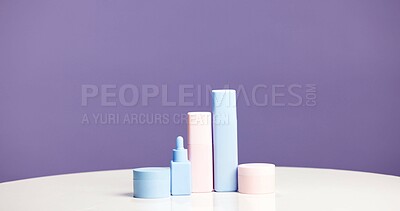 Buy stock photo Bottle, container and marketing for skincare in studio with mockup, space or promotion on purple background. Beauty, product and marketing for cosmetic care, dermatology selection and presentation