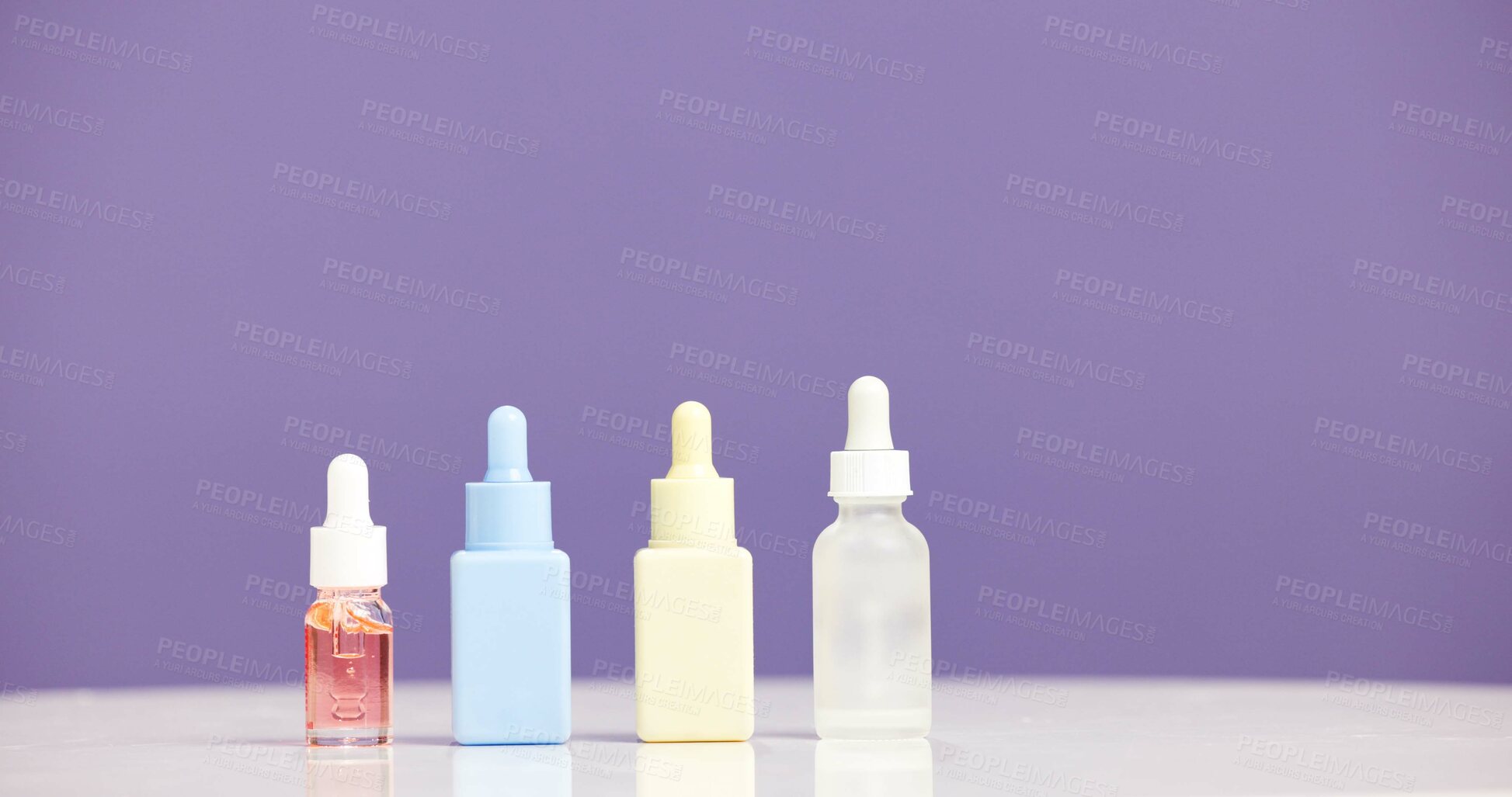Buy stock photo Bottle, serum and marketing for skincare in studio with mockup, space or promotion on purple background. Beauty, product and advertising for cosmetic care, dermatology selection and presentation
