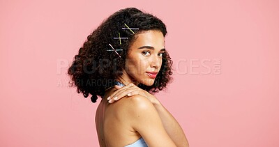 Buy stock photo Portrait, skincare and woman in studio, beauty and dermatology with curly hair on pink background. Mockup space, gen z or person with shine, glow or cosmetics with hairstyle, healthy skin or wellness