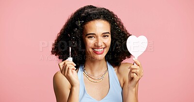 Buy stock photo Cosmetics, mirror and woman portrait with lip gloss in studio, color product or happiness for shine. Lipstick, beauty aesthetic and person with mouth makeup for glow finish, space or pink background