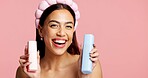 Portrait, skincare product or woman with headband in studio, beauty treatment or self care for wellness. Healthy glow, facial toner or person with dermatology bottles, mockup space or pink background