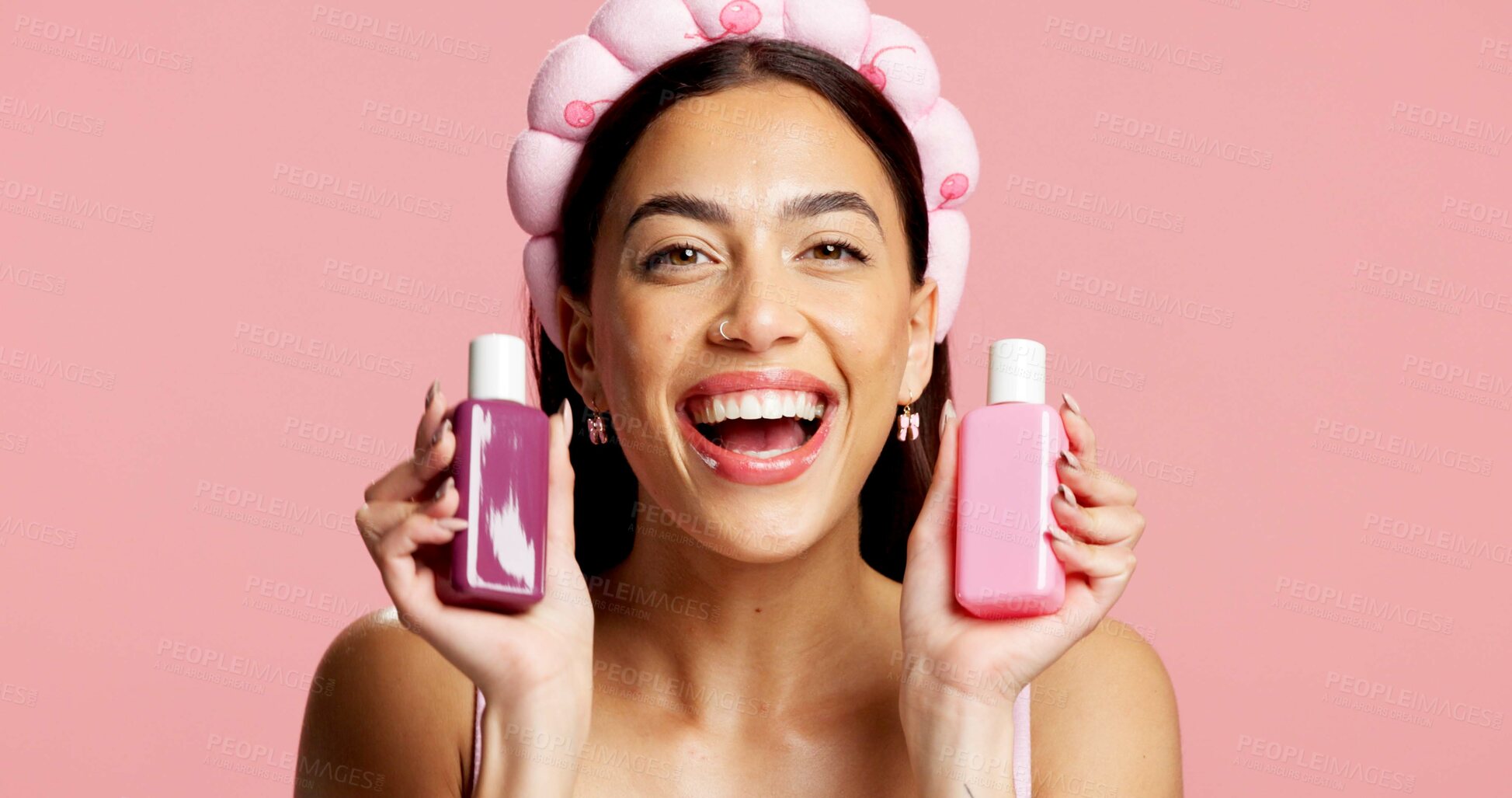 Buy stock photo Portrait, skincare and woman with bottle in studio, beauty treatment or headband for wellness shine. Healthy glow, advertising or person with facial product for dermatology, mockup or pink background