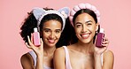 Skincare products, smile and portrait of girl friends in studio for clean, beauty or cosmetic routine. Happy, health and female influencers with dermatology treatment for wellness by pink background.