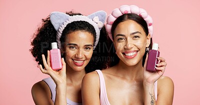 Buy stock photo Skincare products, smile and portrait of girl friends in studio for clean, beauty or cosmetic routine. Happy, health and influencers with advertising or promotion for dermatology by pink background.